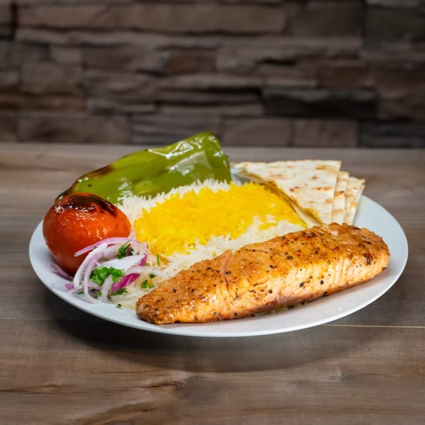 York Kabob's grilled salmon with saffron rice, roasted tomato, green pepper, and pita bread.